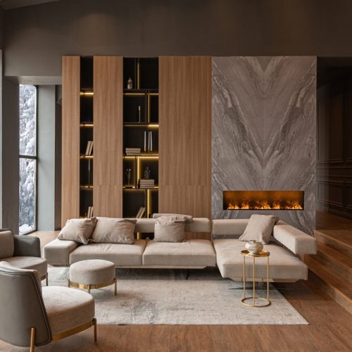 Living,Room,,Marble,Wall,Fireplace,And,Stylish,Bookcase,To,The